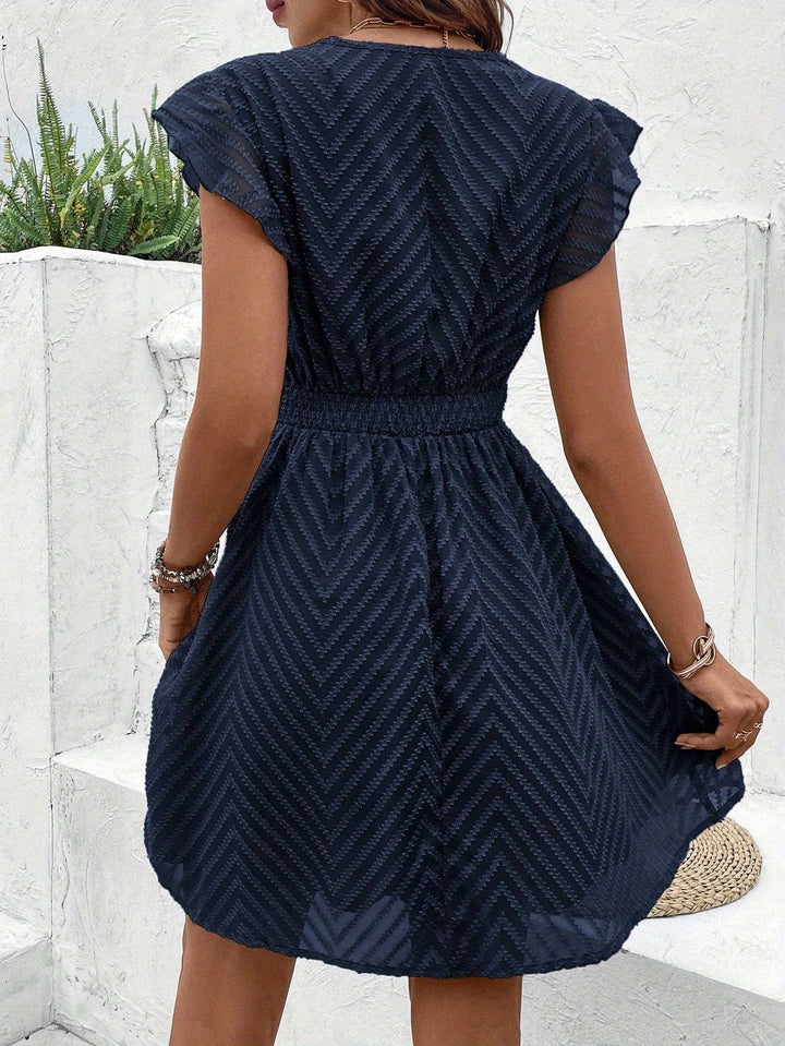 Ärmelloses Nayora Kleid mit V-Ausschnitt
